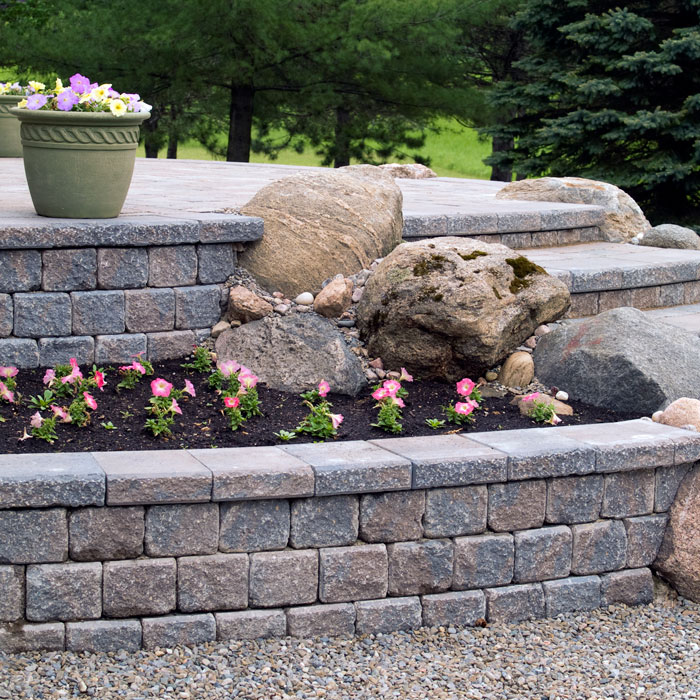 stone retaining wall with flowerbed