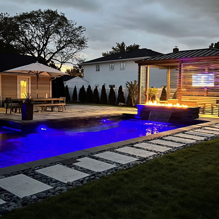 backyard with pool at night