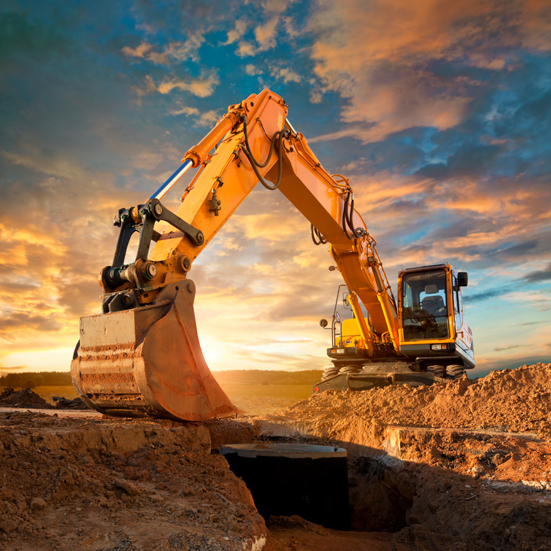 excavator in the sunset